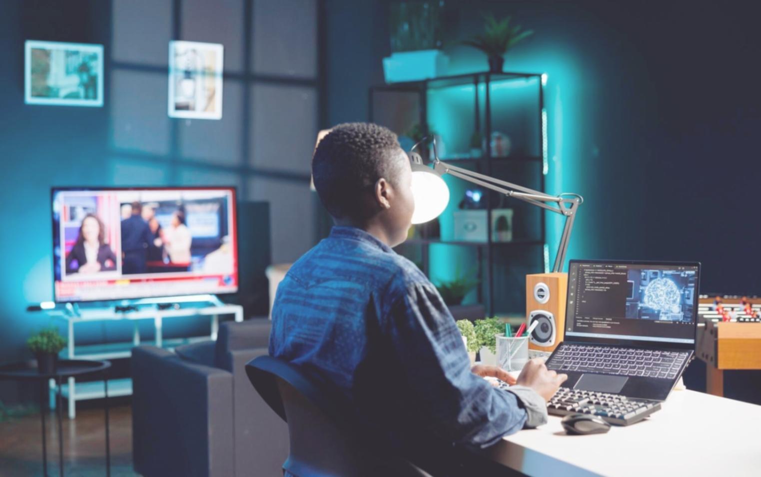 Design team reviewing mobile app interface prototypes on multiple devices